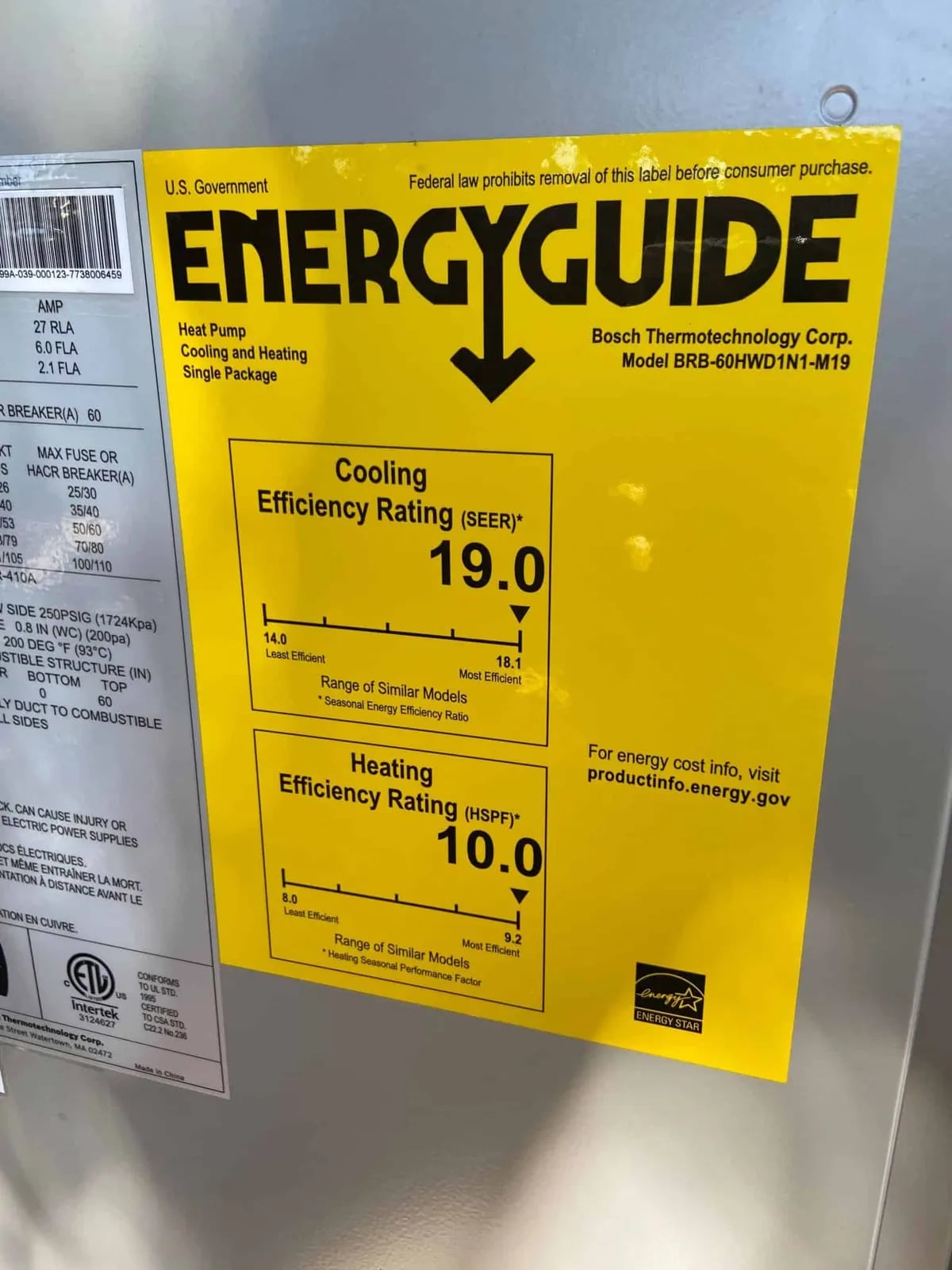 Close-up of a yellow EnergyGuide label on a Bosch heat pump showing its cooling and heating ratings